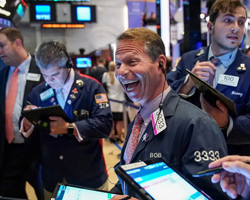 Markets-Rally-as-Dow-Jones-Achieves-First-Record-High-Since-2022-Fueled-by-Federal-Reserve-Dovish-Signals-and-Gold-Surpasses-$2,000-preview